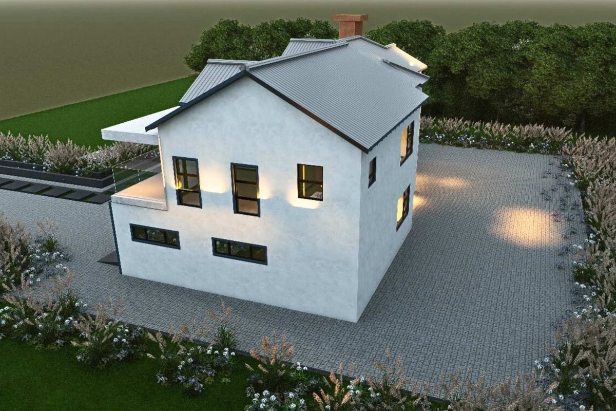 An aerial view of a modern residential property featuring a pitched roof, paved driveway, and landscaped garden areas.