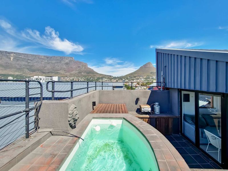 Entertain in Style: Spacious Penthouse with Pool & Views - Photo 2