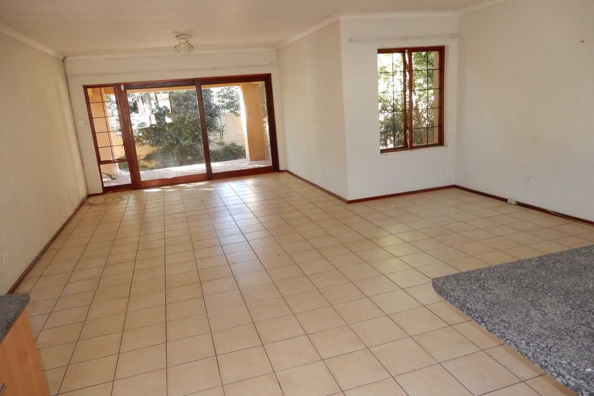 A spacious 2-bedroom freehold cluster home situated in a secure estate in  Douglasdale. - Photo 2