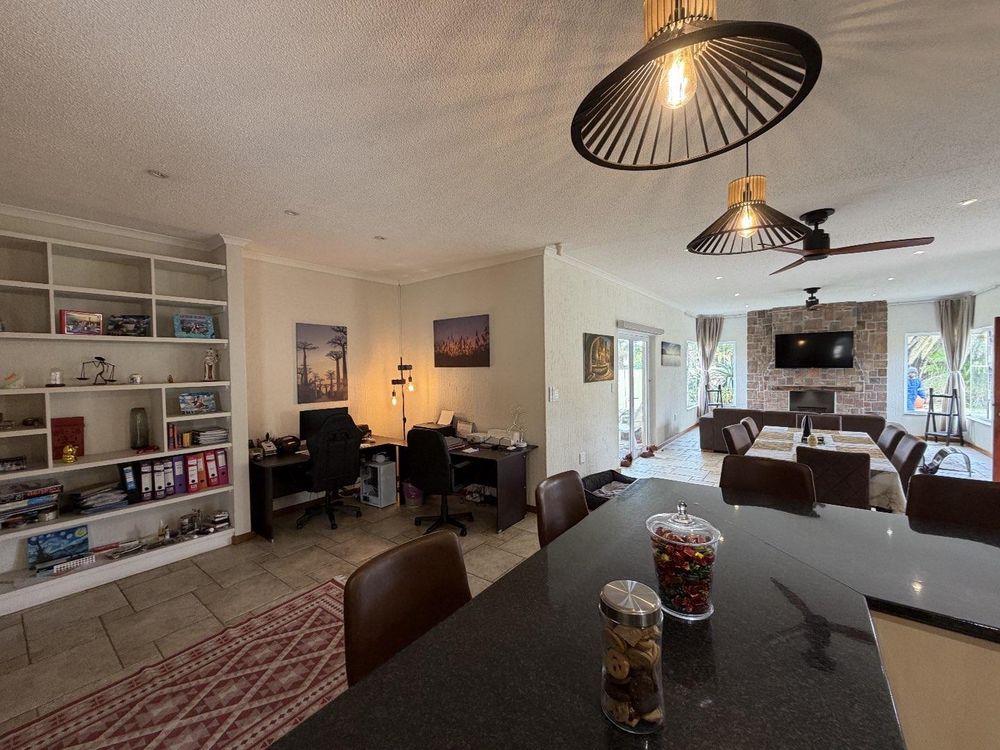 Open plan kitchen with office and living area