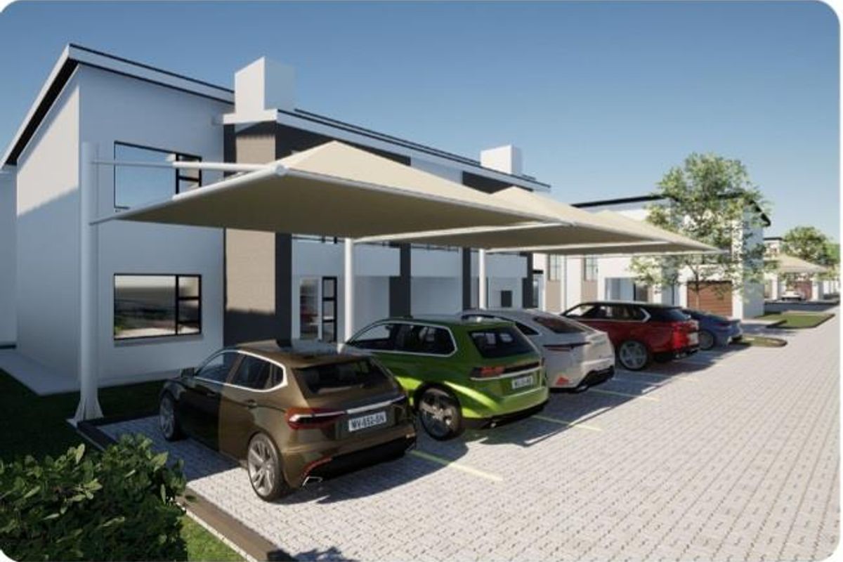 Modern residential exterior featuring paved parking bays with shade cloth structures and contemporary building facade.
