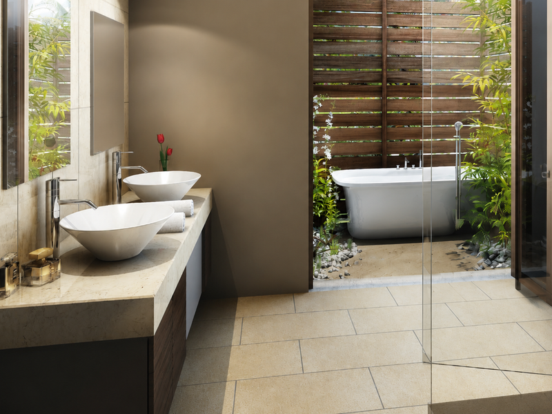 Modern bathroom featuring a double vanity with vessel sinks and a seamless transition to an outdoor area with a freestanding bathtub.