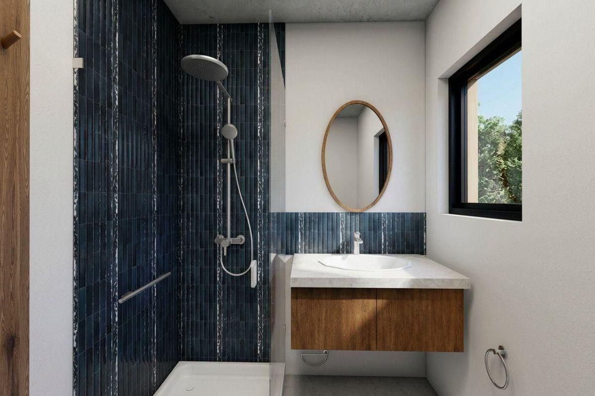 Modern bathroom featuring a walk-in shower with dark blue vertical tiling, a floating wooden vanity with stone countertop, and a sleek basin.