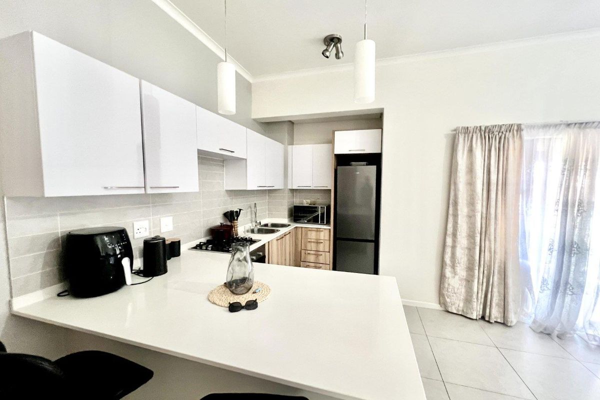 Modern Elegance: 1-Bedroom Gem with Balcony & Braai - Photo 3