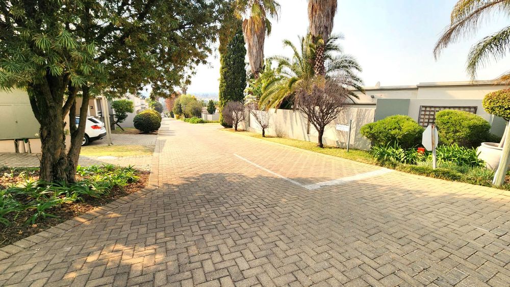 Beautifuly maintained sidewalk gardens along complex driveways.