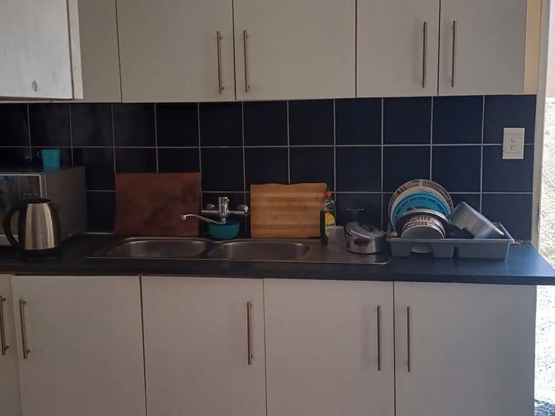 House is situated behind the Okahandja Mall. Additional to the main house is a 4 bedroom flat. - Photo 5