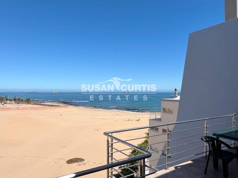 Live by the Sea: Modern Penthouse with Ample Living Space - Photo 2