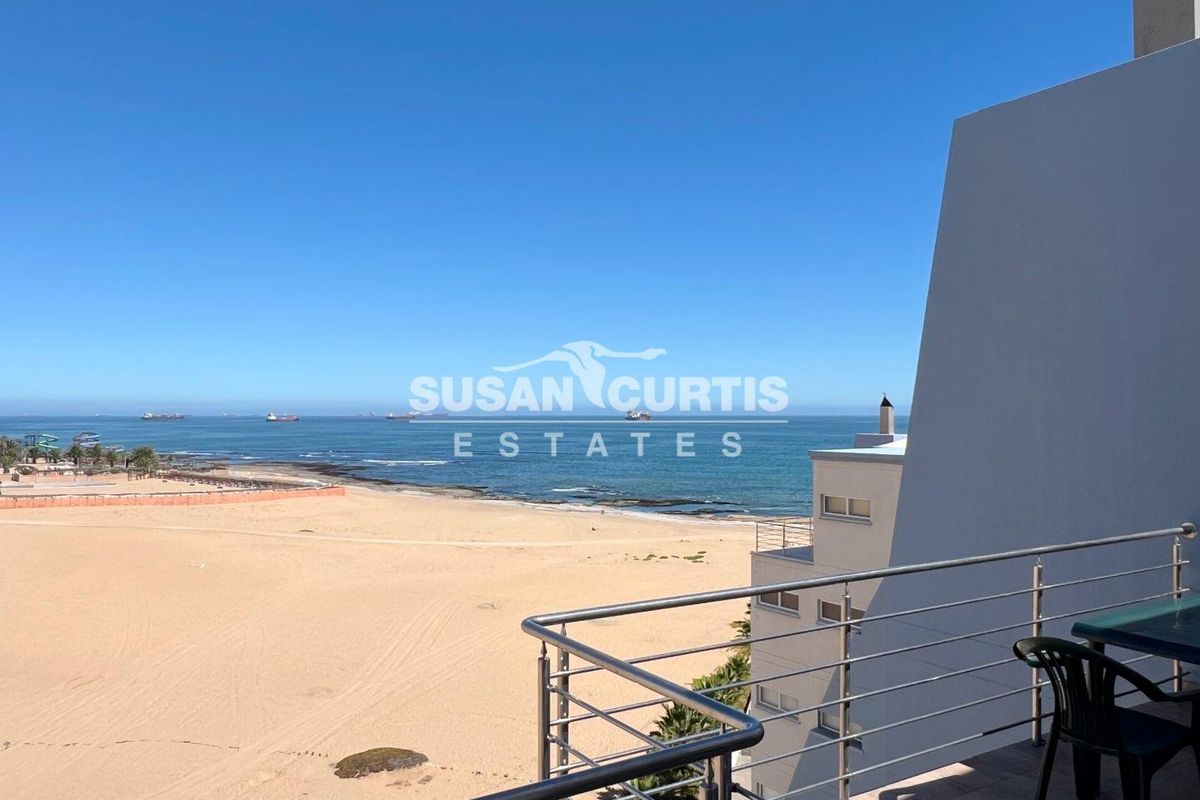 Live by the Sea: Modern Penthouse with Ample Living Space - Photo 2