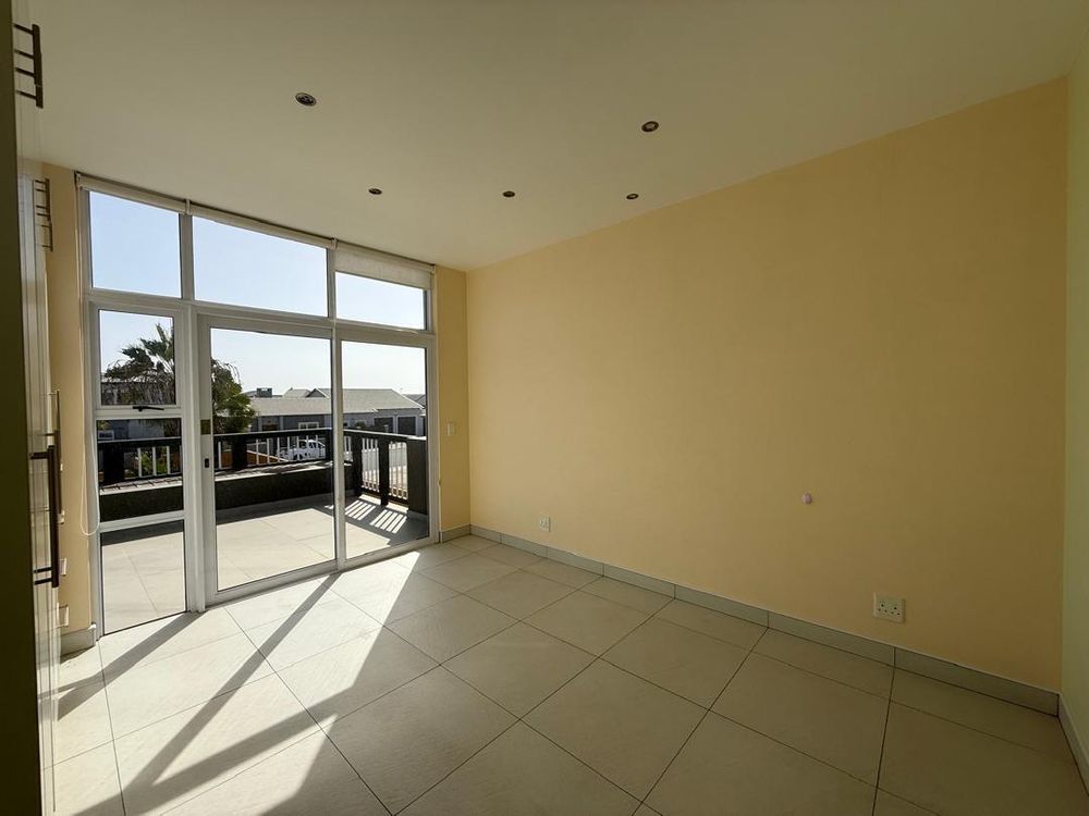 Bedroom one with BIC and balcony