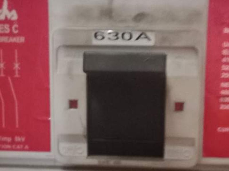 Close-up view of a 630A industrial circuit breaker and thermal magnetic trip unit within an electrical distribution panel.