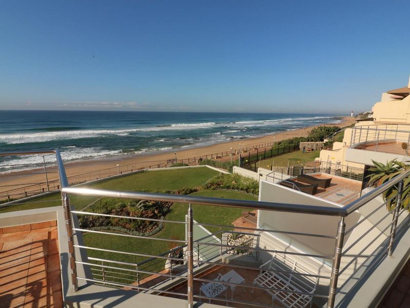Spacious balcony featuring a modern stainless steel balustrade and panoramic ocean views, providing an ideal outdoor space for relaxation.