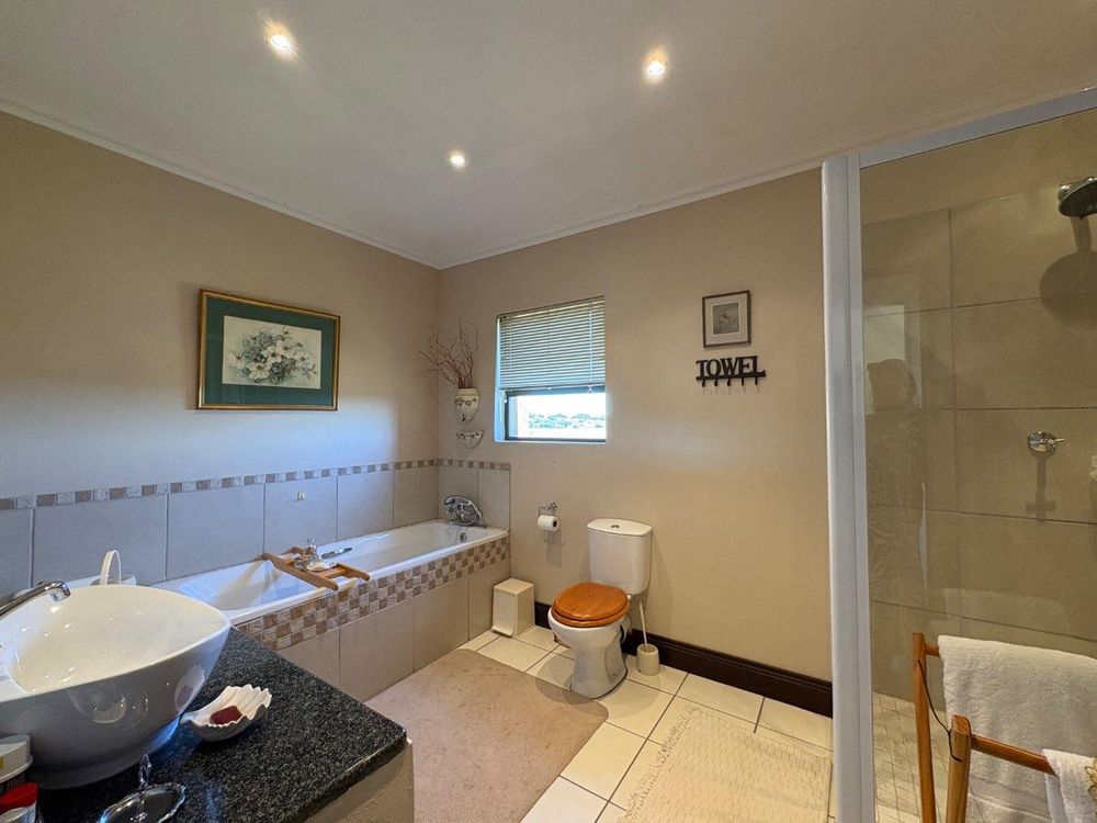 Bathroom on first floor shared by two rooms.