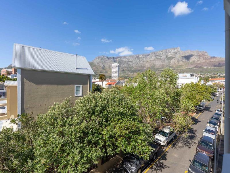 Elevated view overlooking the surrounding neighborhood with a prominent mountain backdrop.