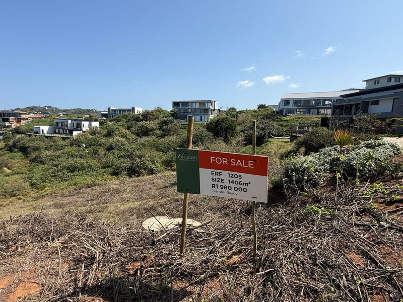 A vacant residential plot of 1406 square meters located in a developed estate, offering potential for custom home construction.