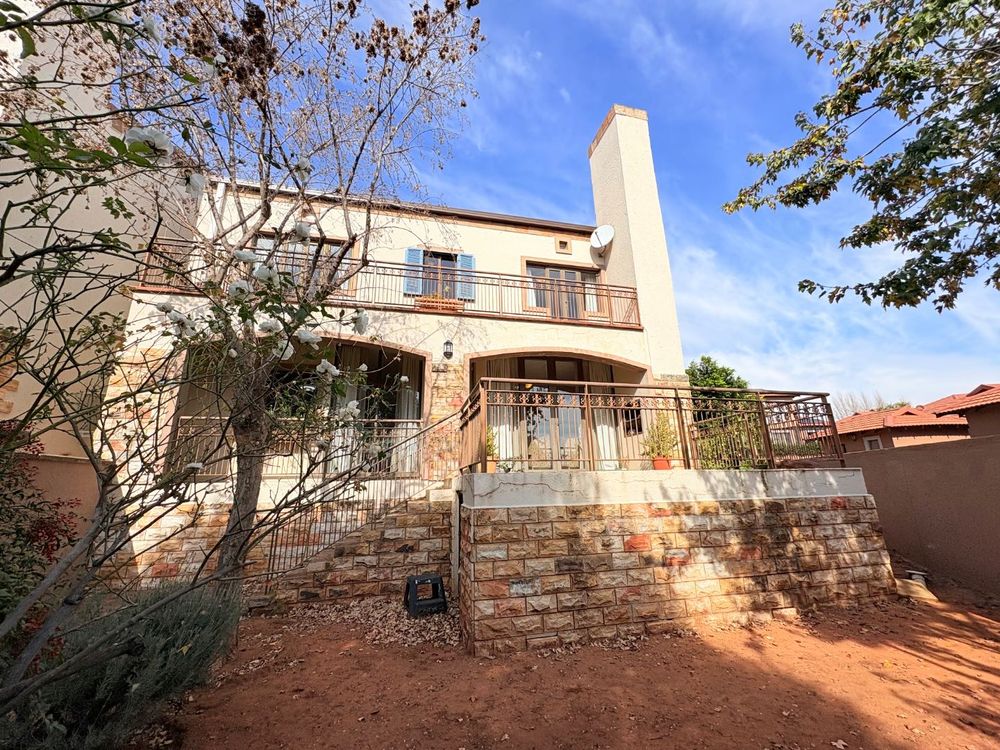 Front view, balcony and garden.