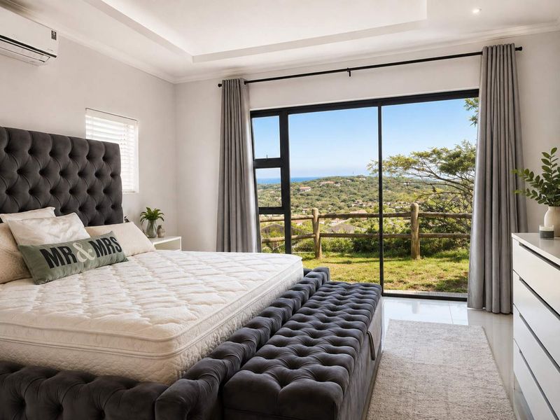 Spacious bedroom featuring a modern recessed ceiling, tiled flooring, and large sliding glass doors that open to a scenic landscape view.