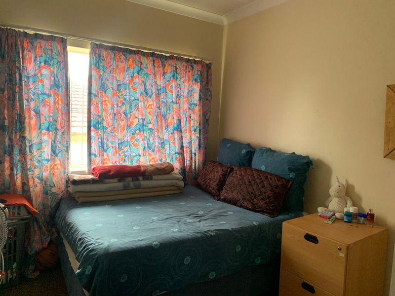 **Charming 3-Bedroom Home with Income Potential in a Tranquil Neighborhood** - Photo 9