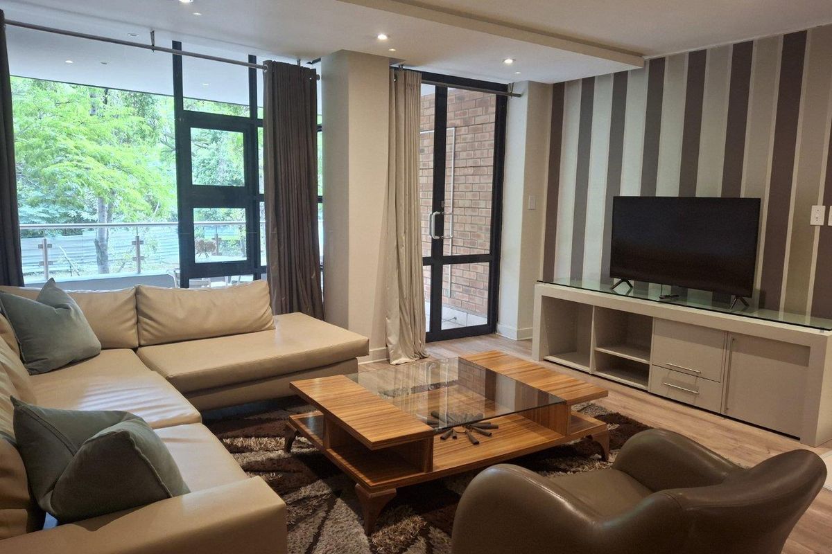 A BEAUTIFULLY FURNISHED TWO BEDROOM APARTMENT - Photo 2