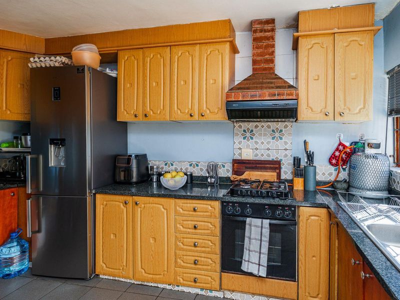 Spacious Hillside Townhouse with Scenic Views & Great Potential - Photo 7