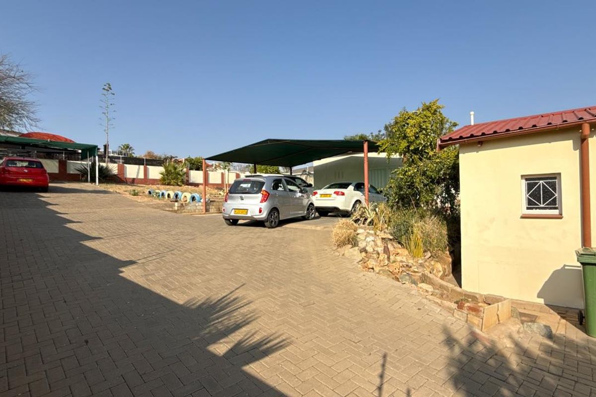 Set high above street level on a massive erf with a large front garden and elevated views - Photo 4