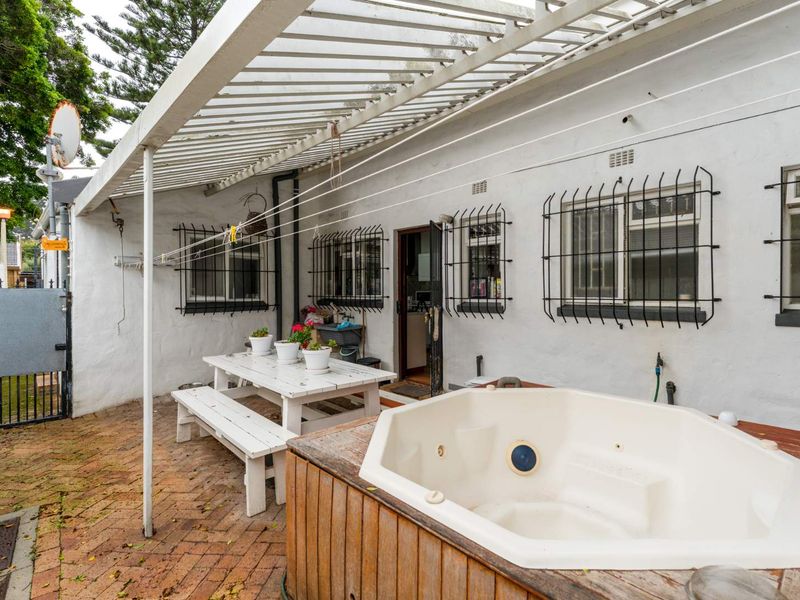 Delightfully spacious and loved family home adorned by lovely secure and established sunny garden plus built-in Braai area - this is a must see! - Photo 9
