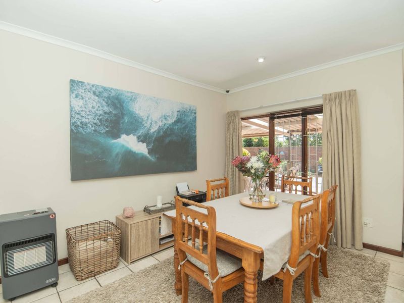 Dining area featuring tiled flooring, recessed lighting, and sliding glass doors providing direct access to the outdoor patio space.