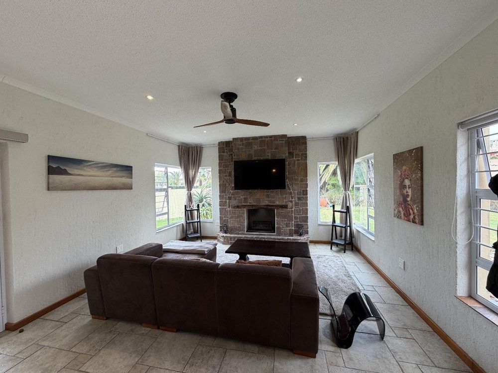 TV room with indoor fire place