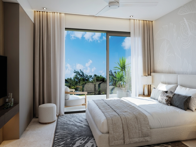 Modern bedroom featuring high-quality finishes, built-in cabinetry, recessed lighting, and a large sliding glass door providing access to an outdoor balcony.