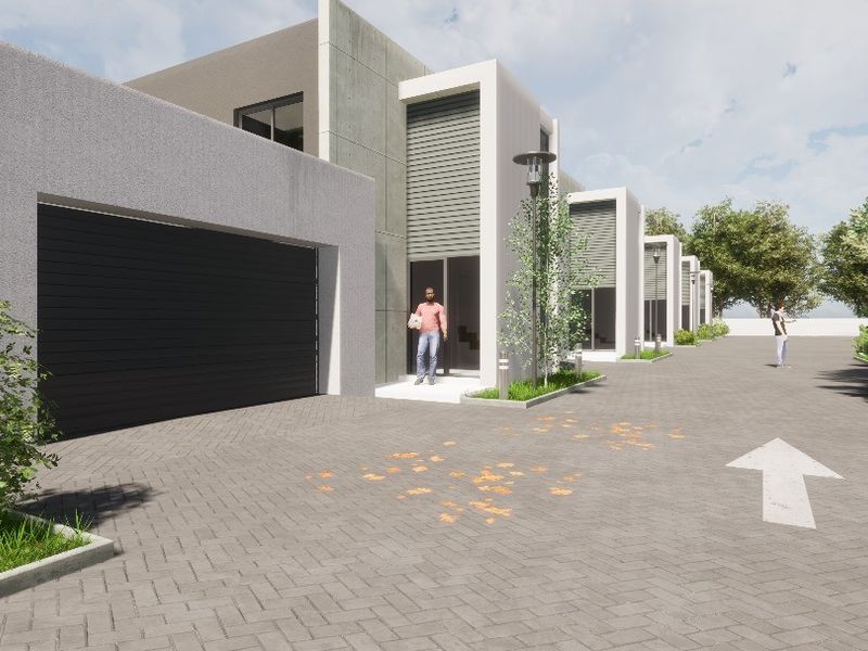 A modern residential exterior featuring a paved driveway, garage access, and contemporary architectural design.