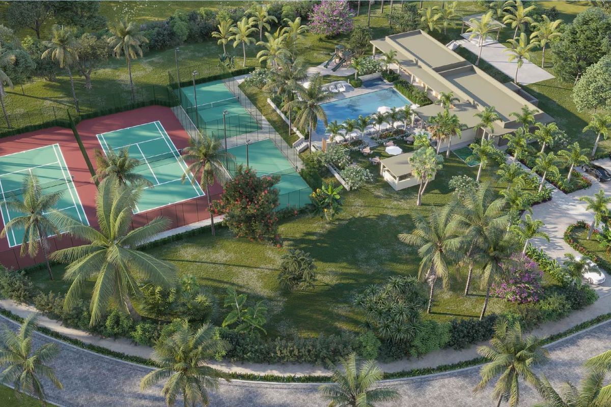 Aerial view of a luxury residential estate featuring tennis courts, a swimming pool, landscaped gardens, and a clubhouse facility.