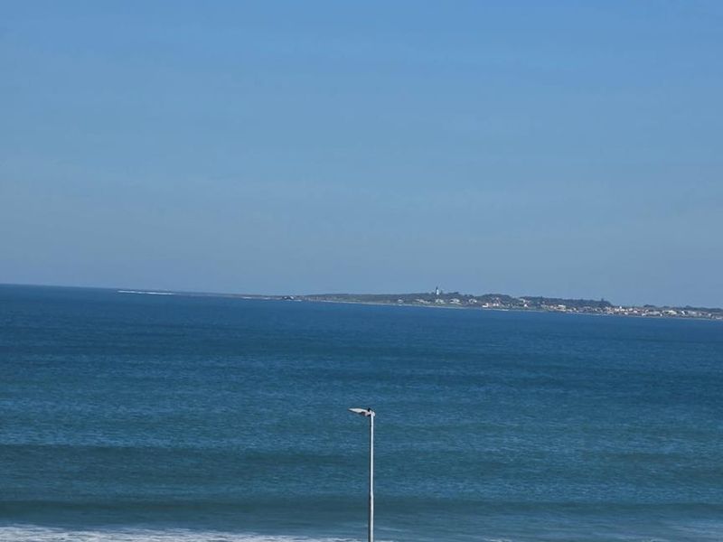 A clear, elevated view of the ocean and coastline, showcasing the property's scenic outlook.