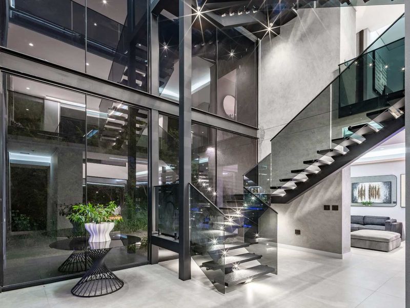 The "James Bond" Residence of Steyn City: A Masterpiece in Glass & Gloss - Photo 4