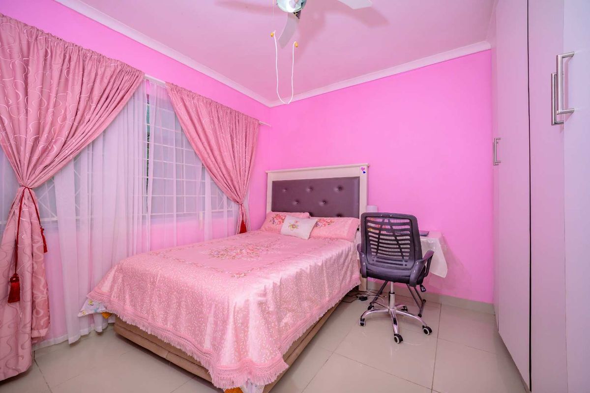 A bedroom featuring tiled flooring, a ceiling fan, security bars on the window, and a built-in wardrobe.