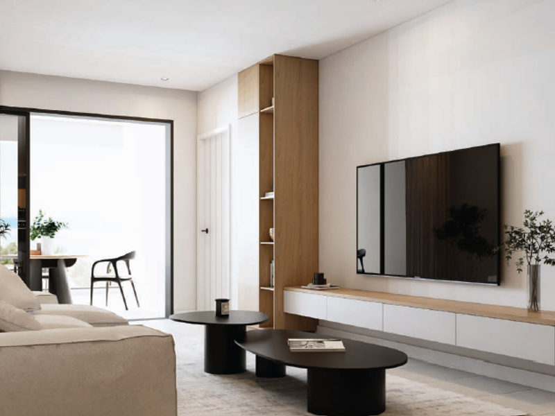 Modern living room featuring built-in cabinetry, a floating media console, and large sliding glass doors leading to an outdoor balcony area.