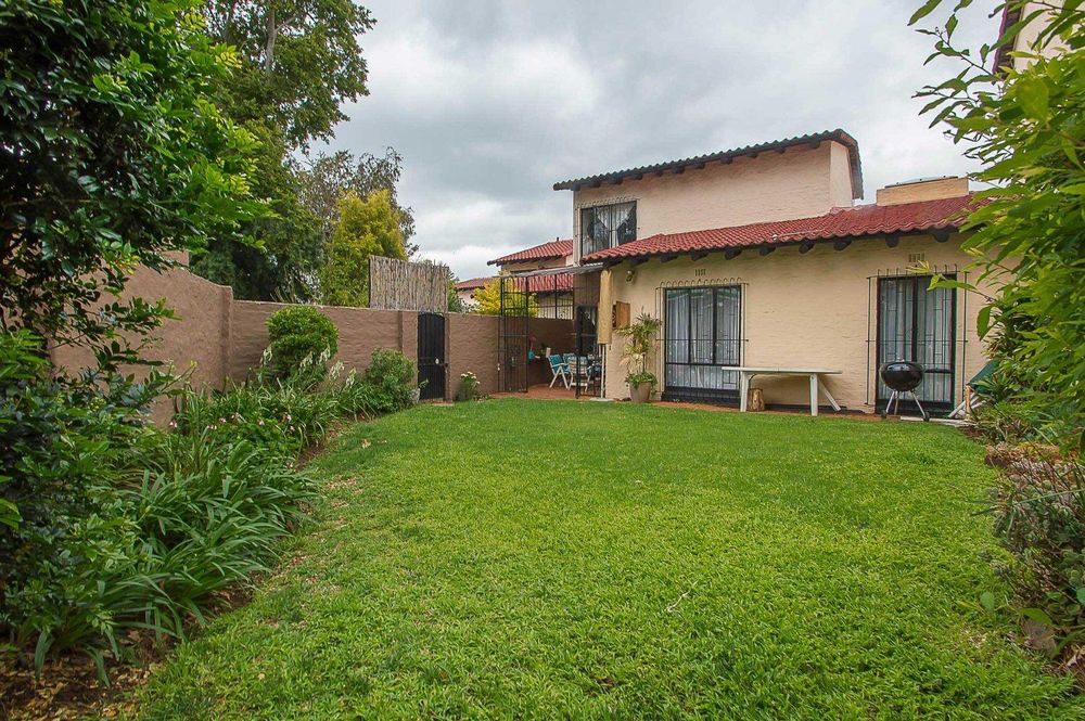 Spacious private back garden within complex grounds