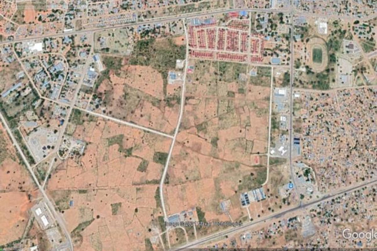 An aerial view of the industrial property site showing surrounding infrastructure and road access.