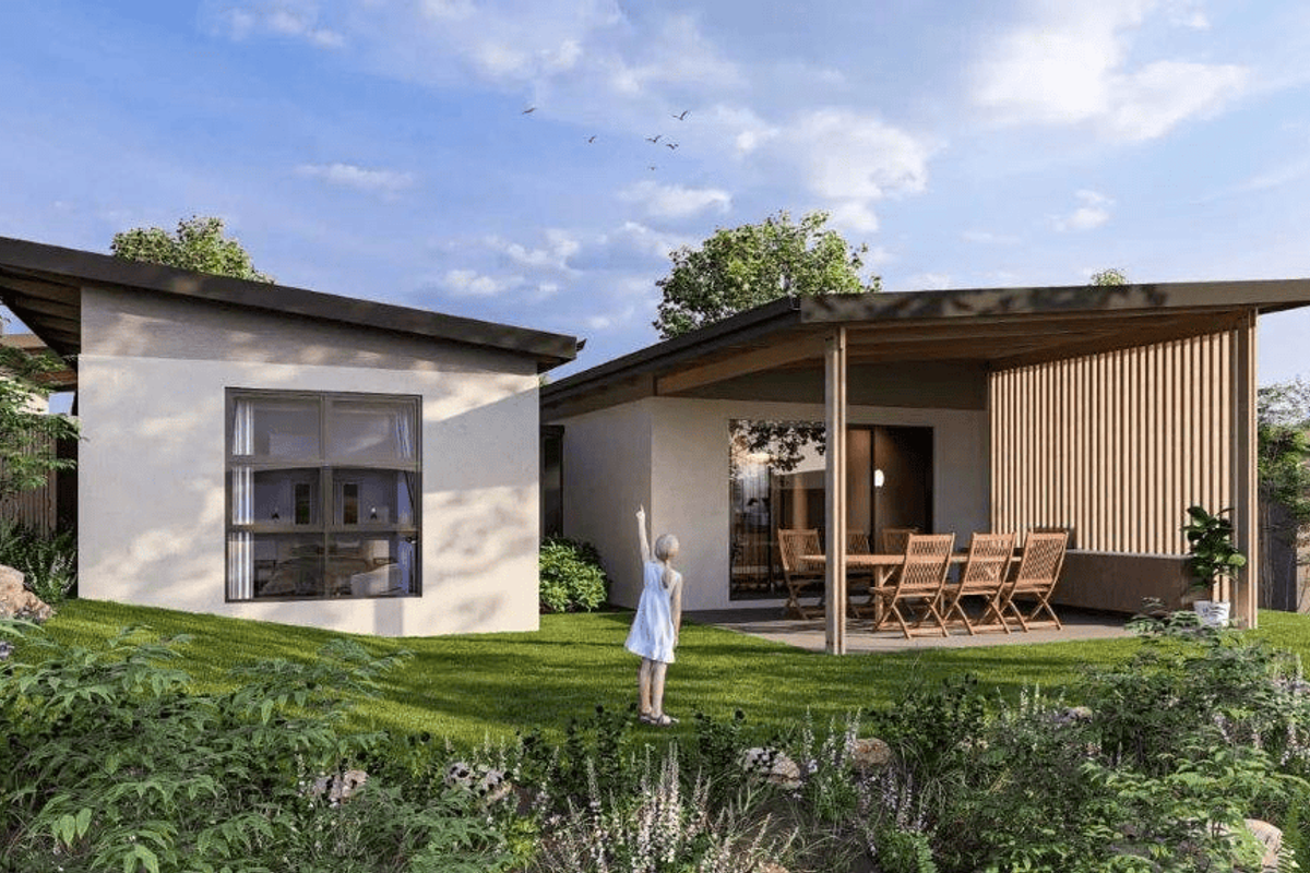 A modern townhouse rear elevation featuring a covered patio with timber slat screening, large windows, and a landscaped garden area.