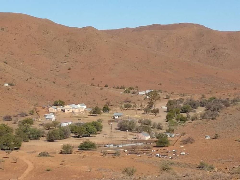 Farm and its farm houses as seen from one of the hills