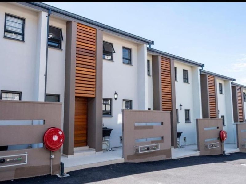 Modern Escombe Townhouse: Secure, Stylish, and Ready for You! - Photo 1
