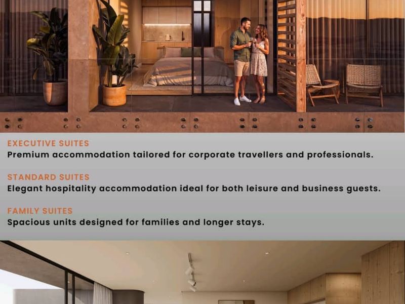 A modern open-plan hotel suite featuring a kitchenette, sleeping area, and seamless transition to a private balcony with ocean views.