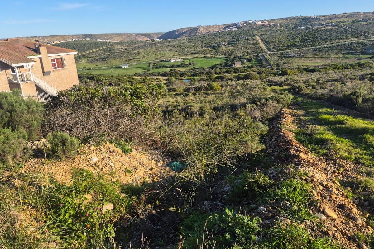 A scenic view overlooking the natural landscape and surrounding hills from the vacant residential property.