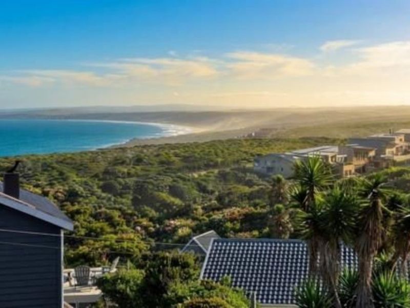 A scenic elevated view overlooking the coastal landscape and surrounding residential estate, capturing the natural beauty of the area.