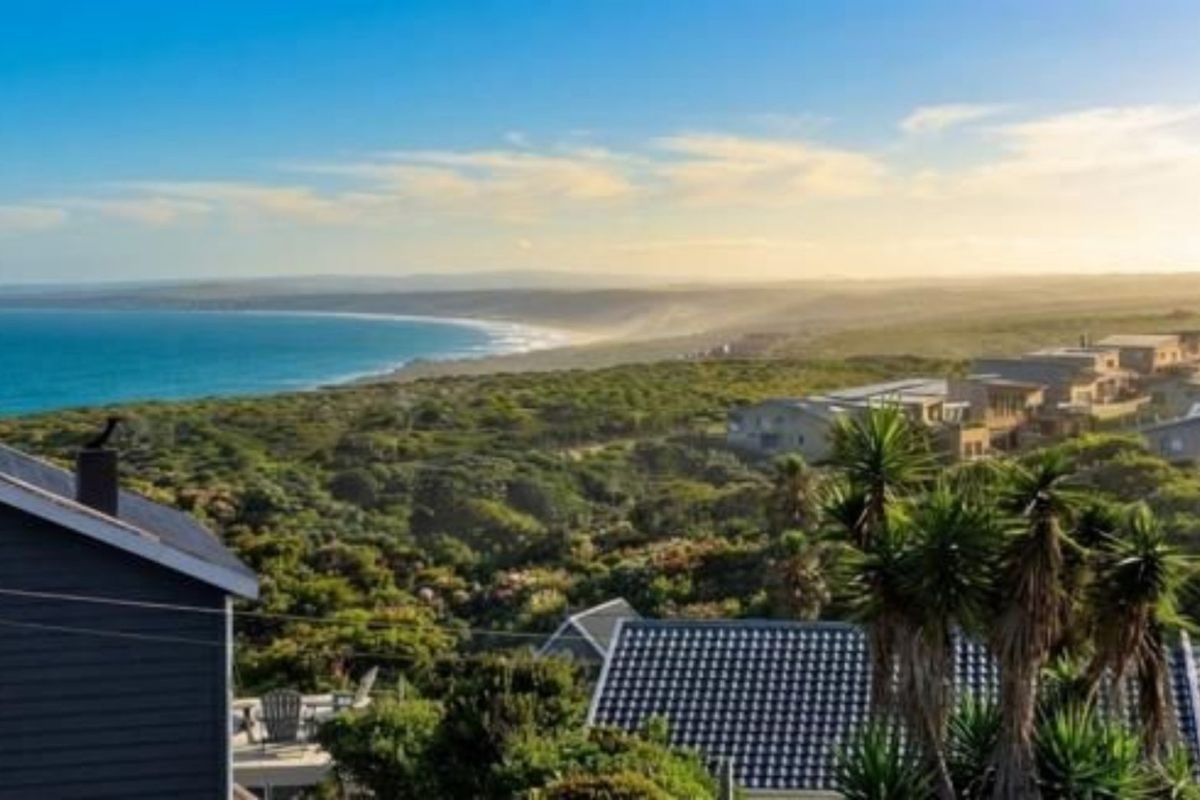 A scenic elevated view overlooking the coastal landscape and surrounding residential estate, capturing the natural beauty of the area.