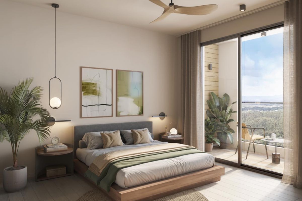 Modern bedroom featuring a ceiling fan, integrated lighting, and large sliding glass doors opening onto a private balcony with scenic views.