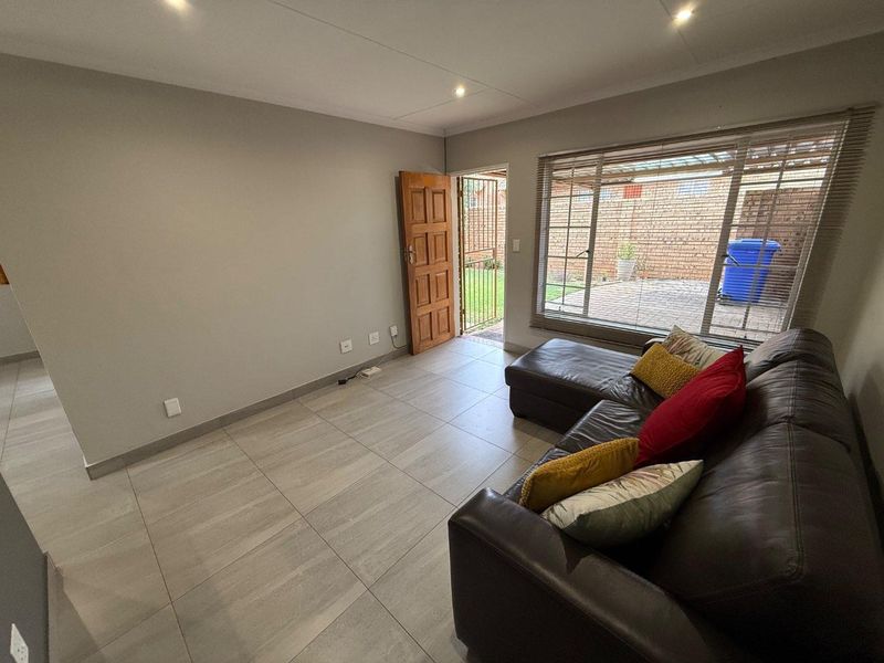 Stylishly Renovated Two-Bedroom Simplex with Double Garage and Garden - Photo 6
