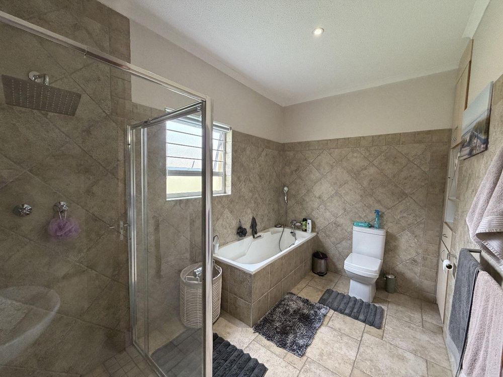 Shared en-suite bathroom with shower and bath