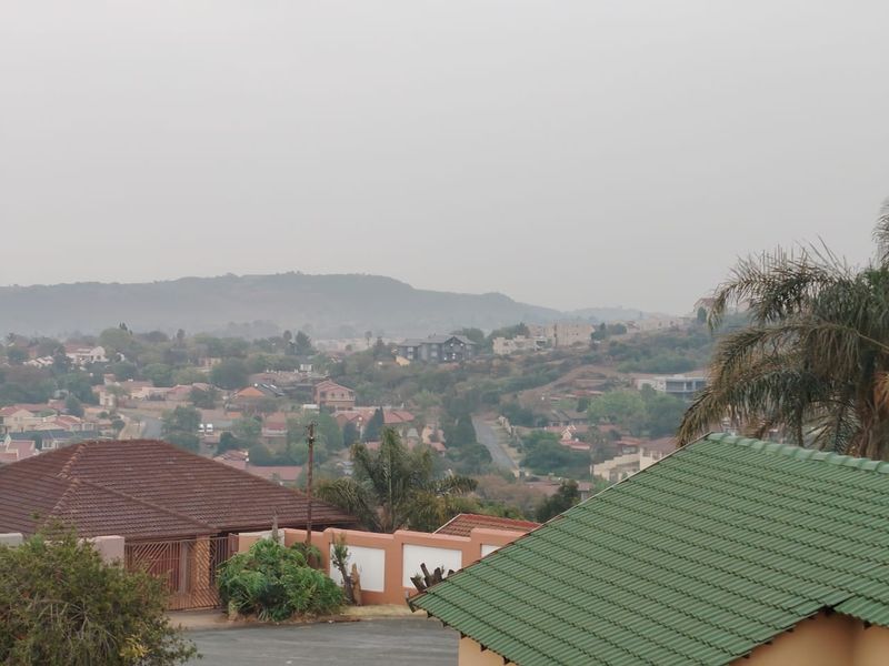 Elevated view overlooking the surrounding residential neighbourhood and distant hills.