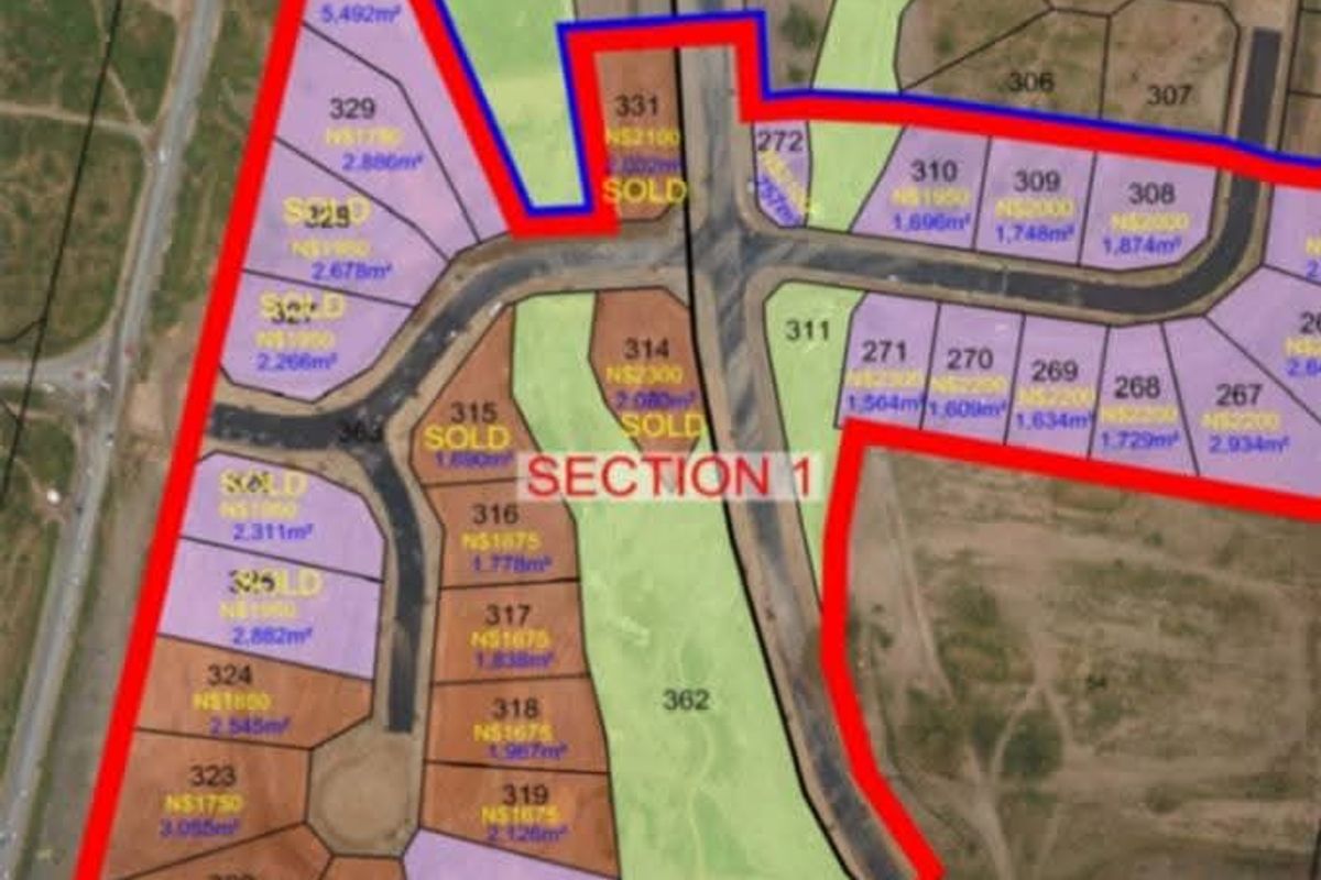 An aerial site layout plan showing subdivided industrial plots and road infrastructure within the Lafrenz industrial area.