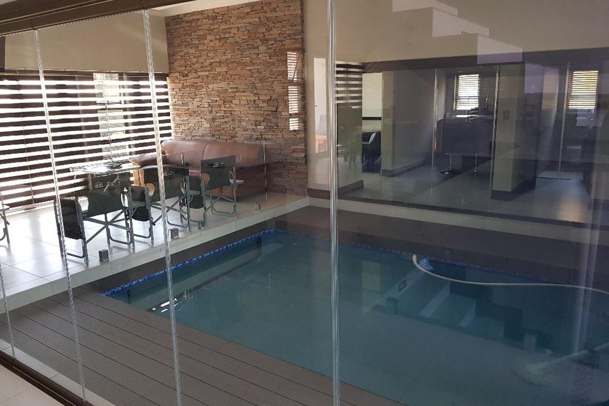 Elegant Family Home with Stunning Pool Feature - Photo 4