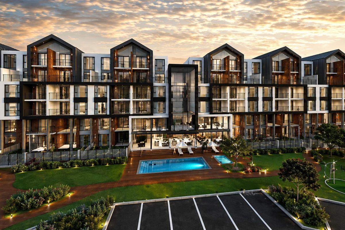 A modern apartment complex featuring a swimming pool, landscaped gardens, and private balconies, showcasing contemporary architectural design and well-maintained outdoor amenities.